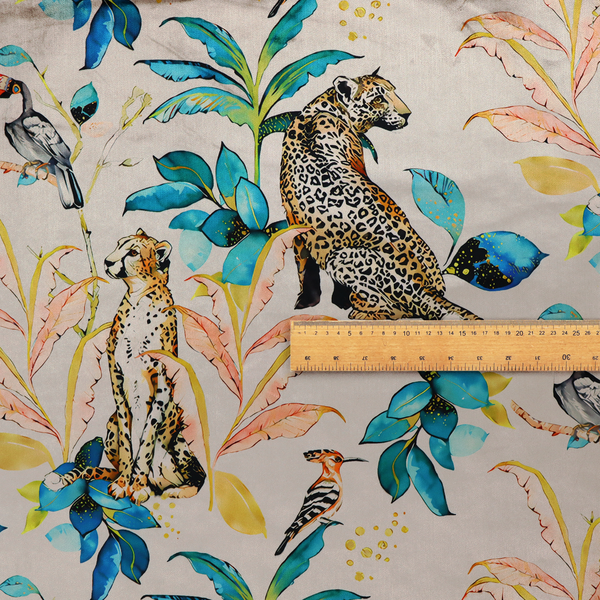Exotic cream, blue, and orange fabric featuring a tropical jungle pattern with leopards, cheetahs, toucans, exotic birds, and lush foliage.   