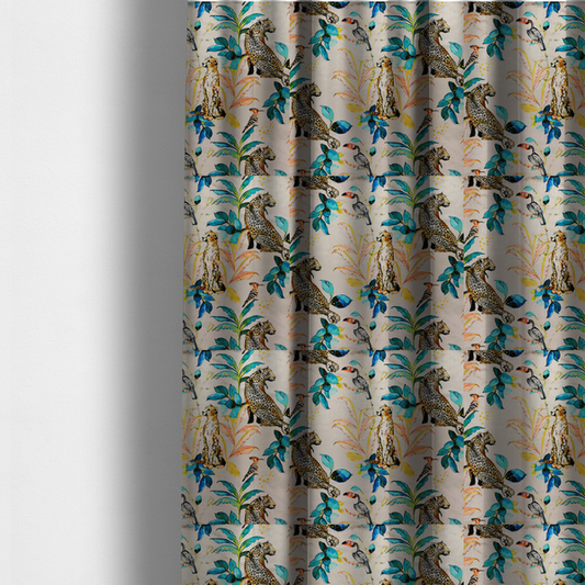 The fabric used to create these made-to-measure curtains is an exotic cream, blue, and orange fabric featuring a tropical jungle pattern with leopards, cheetahs, toucans, exotic birds, and lush foliage.   
