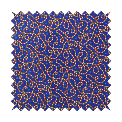 Blue and red fabric featuring an intricate festive pattern with continuous wiggly candy cane lines and tiny white snowflakes scattered across the deep blue background.   