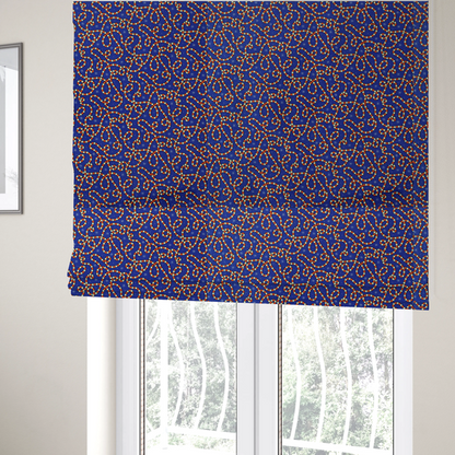 The fabric used to create these Roman blinds is a blue and red fabric featuring an intricate festive pattern with continuous wiggly candy cane lines and tiny white snowflakes scattered across the deep blue background.   