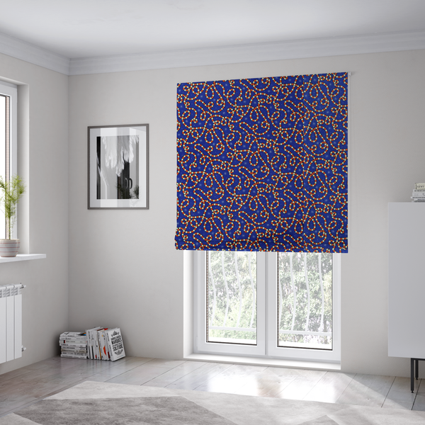 The fabric used to create these Roman blinds is a blue and red fabric featuring an intricate festive pattern with continuous wiggly candy cane lines and tiny white snowflakes scattered across the deep blue background.   