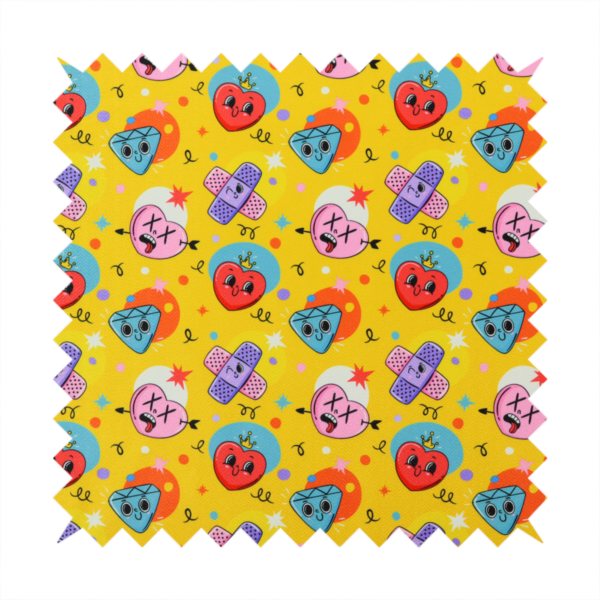 Yellow fabric featuring a playful, quirky pattern with cartoon-style graphics including smiling hearts with crowns, cute diamonds, cartoon bandages, and wacky faces with X eyes on a bright yellow background.   