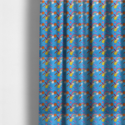 The fabric used to create these made-to-measure curtains is a blue fabric featuring a playful back-to-school pattern with colourful rainbows, basketballs, yellow notebooks with red pencils, purple paper airplanes, and school supplies scattered across a bright blue background.