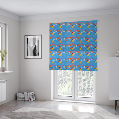 The fabric used to create these Roman blinds is a blue fabric featuring a playful back-to-school pattern with colourful rainbows, basketballs, yellow notebooks with red pencils, purple paper airplanes, and school supplies scattered across a bright blue background.