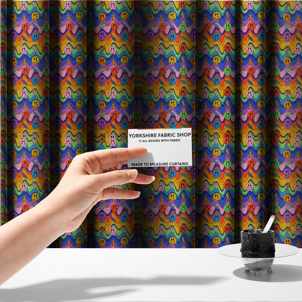 The fabric used to create these made-to-measure curtains is a multicolour fabric featuring a psychedelic groove pattern with wavy horizontal stripes in shades of blue, purple, green, yellow, and orange, interspersed with smiling smiley faces and lightning bolts.