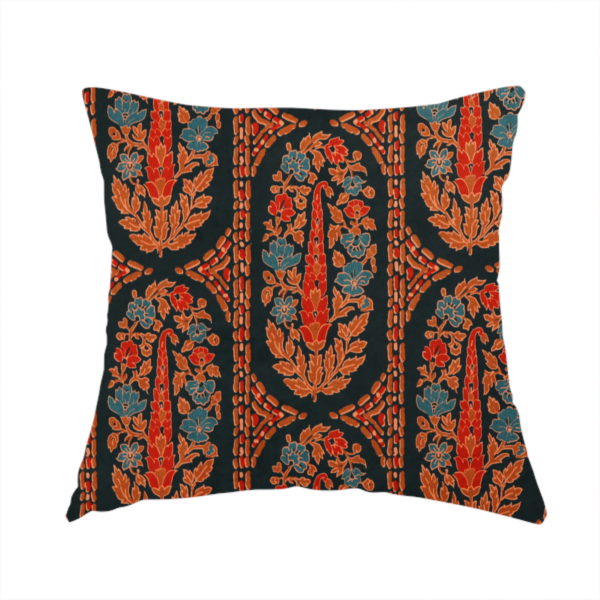 The fabric used to create this handmade cushion is an ornate botanical paisley pattern with large vertical oval medallions filled with red floral motifs, orange leaves, and blue flowers, separated by decorative dashed stripes.