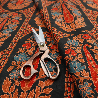 Ornate botanical paisley pattern with large vertical oval medallions filled with red floral motifs, orange leaves, and blue flowers, separated by decorative dashed stripes.