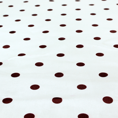 White and brown fabric featuring a classic polka dot pattern with evenly spaced dark dots set against a clean white background.   
PNG