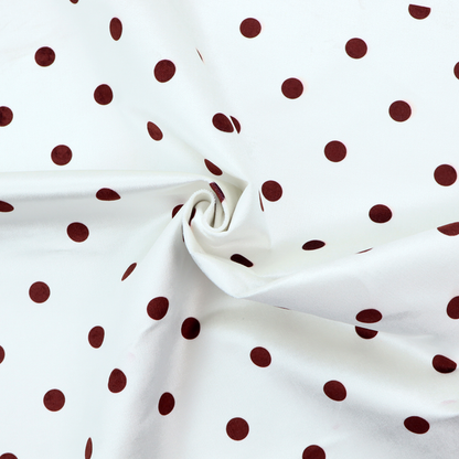 White and brown fabric featuring a classic polka dot pattern with evenly spaced dark dots set against a clean white background.   
PNG