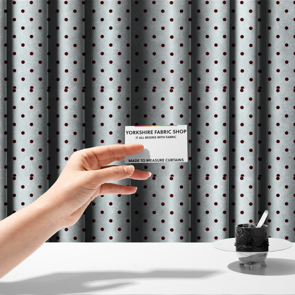 The fabric used to create these made-to-measure curtains is a white and brown fabric featuring a classic polka dot pattern with evenly spaced dark dots set against a clean white background.   
PNG