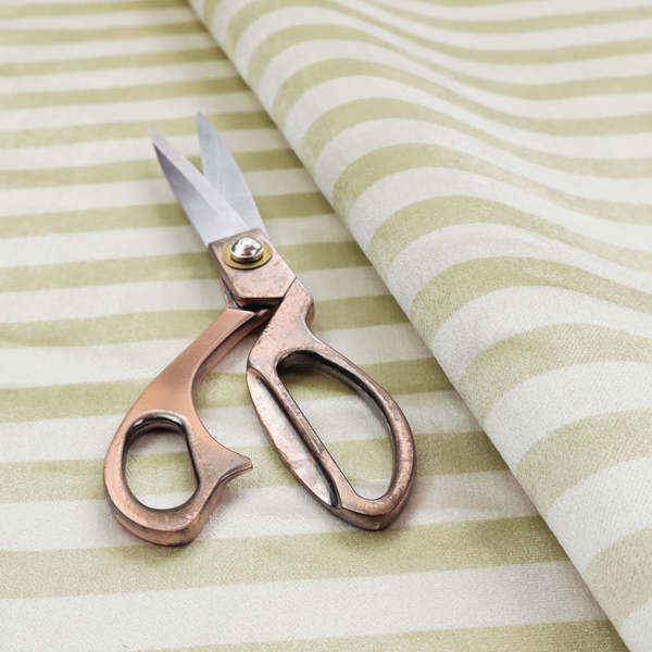 Horizontal beige and white striped fabric pattern.