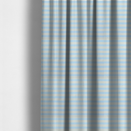 The fabric used to create these made-to-measure curtains is a horizontal light blue and white striped fabric pattern.