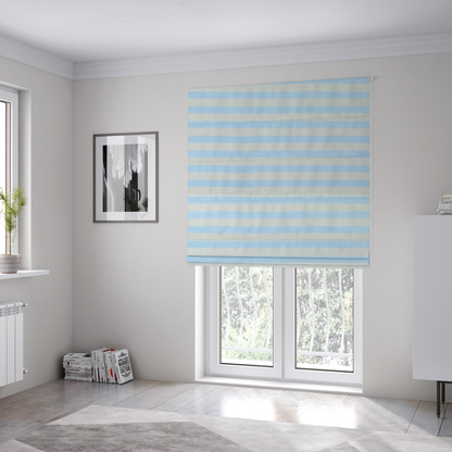The fabric used to create these Roman blinds is a horizontal light blue and white striped fabric pattern.