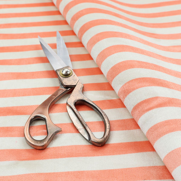 Horizontal coral and white striped fabric pattern.