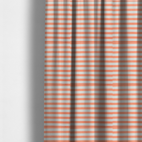 The fabric used to create these made-to-measure curtains is a horizontal coral and white striped fabric pattern.