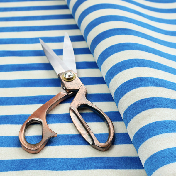 Horizontal blue and white striped fabric pattern.