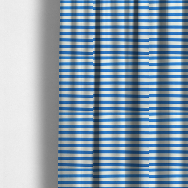 The fabric used to create these made-to-measure curtains is a horizontal blue and white striped fabric pattern.