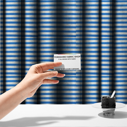 The fabric used to create these made-to-measure curtains is a horizontal blue and white striped fabric pattern.