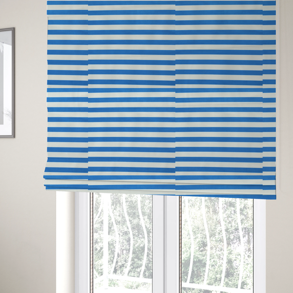 The fabric used to create these Roman blinds is a horizontal blue and white striped fabric pattern.