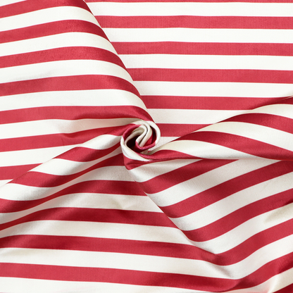 Horizontal red and white striped fabric pattern.