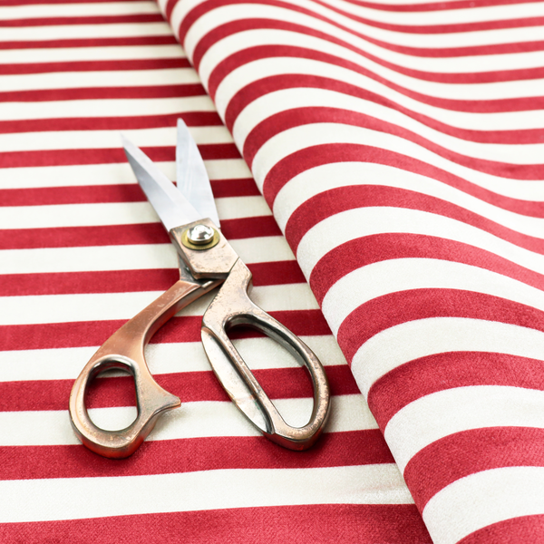 Horizontal red and white striped fabric pattern.