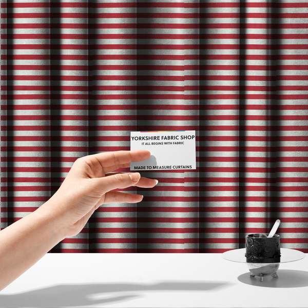 The fabric used to create these made-to-measure curtains is a horizontal red and white striped fabric pattern.