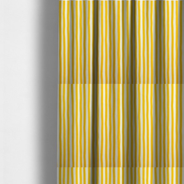 The fabric used to create these made-to-measure curtains is a white fabric patterned with vertical, hand-drawn yellow stripes that feature a slight, organic waviness.   

