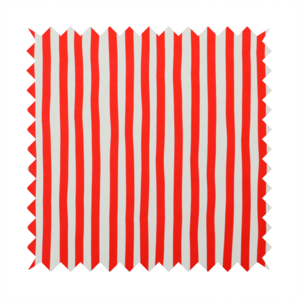 A white fabric patterned with vertical, hand-drawn red stripes that feature a slight, organic waviness.