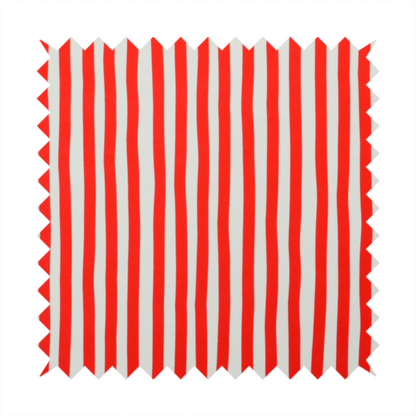 A white fabric patterned with vertical, hand-drawn red stripes that feature a slight, organic waviness.