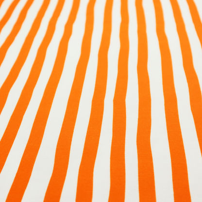 A white fabric patterned with vertical, hand-drawn orange stripes that feature a slight, organic waviness.