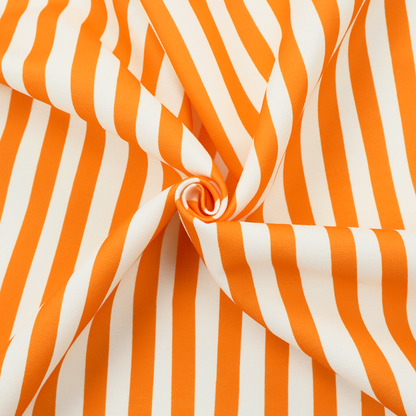 A white fabric patterned with vertical, hand-drawn orange stripes that feature a slight, organic waviness.