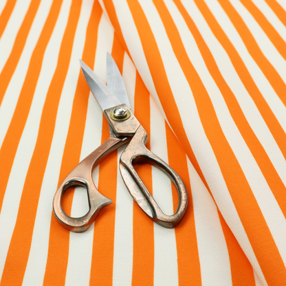 A white fabric patterned with vertical, hand-drawn orange stripes that feature a slight, organic waviness.