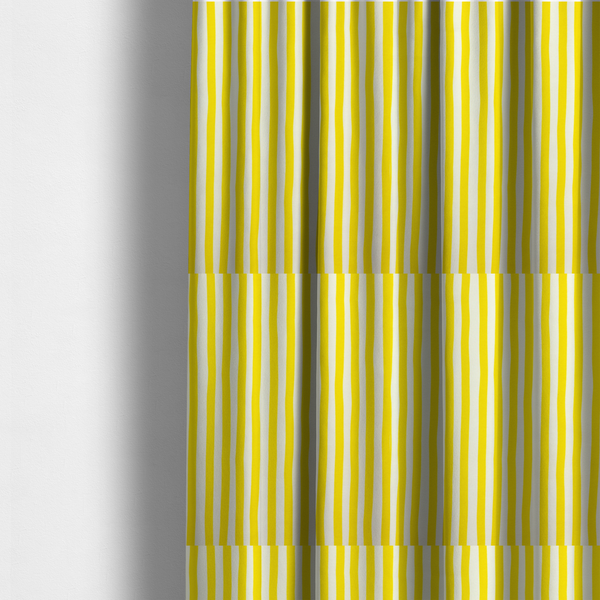 The fabric used to create these made-to-measure curtains is a white fabric patterned with vertical, hand-drawn yellow stripes that feature a slight, organic waviness.