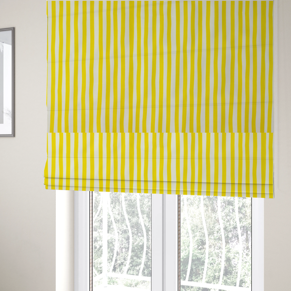The fabric used to create these Roman blinds is a white fabric patterned with vertical, hand-drawn yellow stripes that feature a slight, organic waviness.