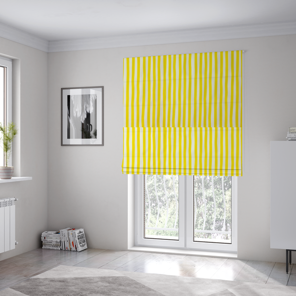 The fabric used to create these Roman blinds is a white fabric patterned with vertical, hand-drawn yellow stripes that feature a slight, organic waviness.