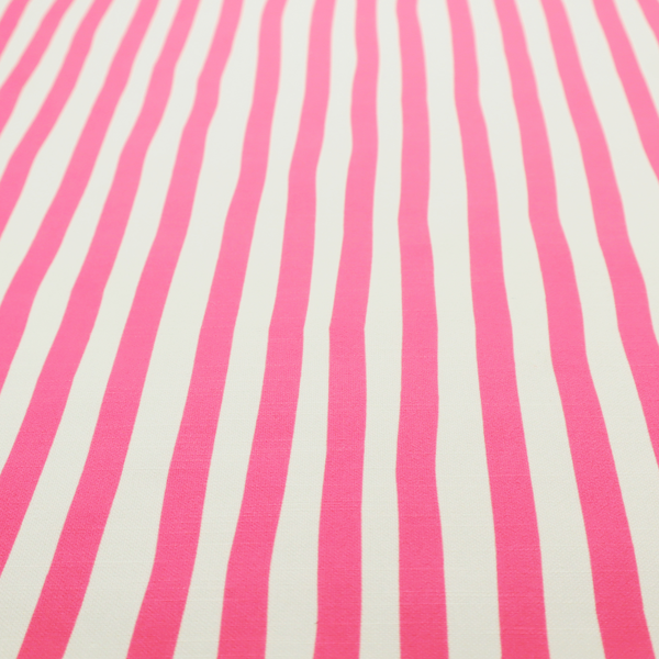 A white fabric patterned with vertical, hand-drawn pink stripes that feature a slight, organic waviness.