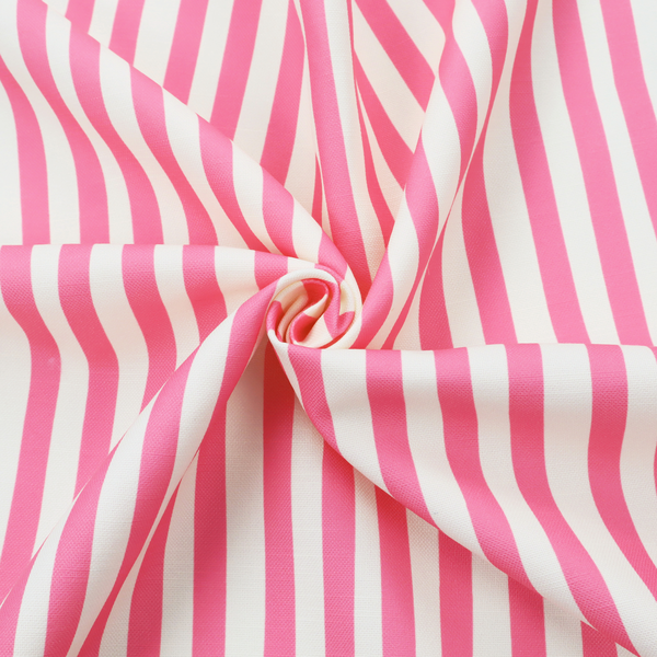 A white fabric patterned with vertical, hand-drawn pink stripes that feature a slight, organic waviness.