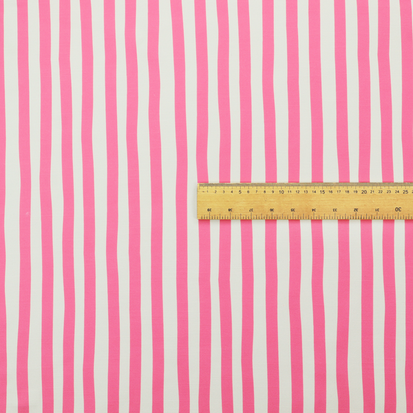 A white fabric patterned with vertical, hand-drawn pink stripes that feature a slight, organic waviness.
