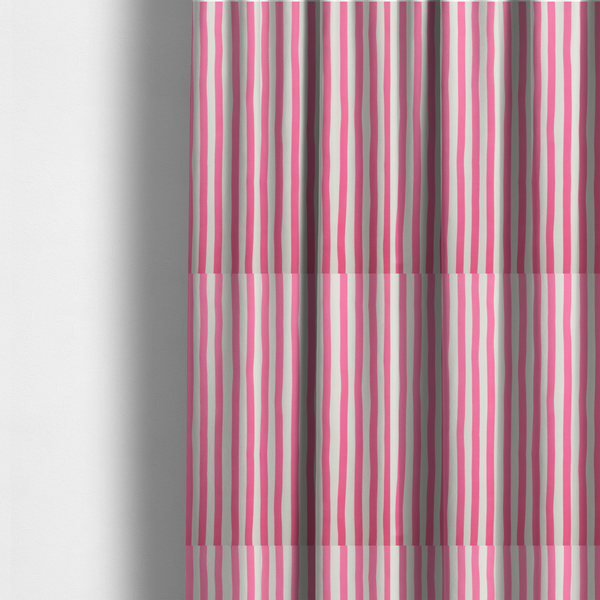 The fabric used to create these made-to-measure curtains is a white fabric patterned with vertical, hand-drawn pink stripes that feature a slight, organic waviness.
