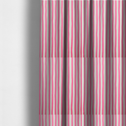 The fabric used to create these made-to-measure curtains is a white fabric patterned with vertical, hand-drawn pink stripes that feature a slight, organic waviness.