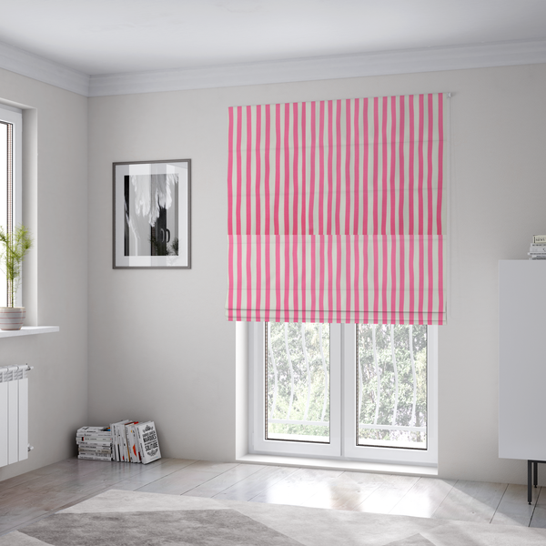 The fabric used to create these Roman blinds is a white fabric patterned with vertical, hand-drawn pink stripes that feature a slight, organic waviness.