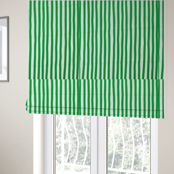 The fabric used to create these Roman blinds is a white fabric patterned with vertical, hand-drawn green stripes that feature a slight, organic waviness.