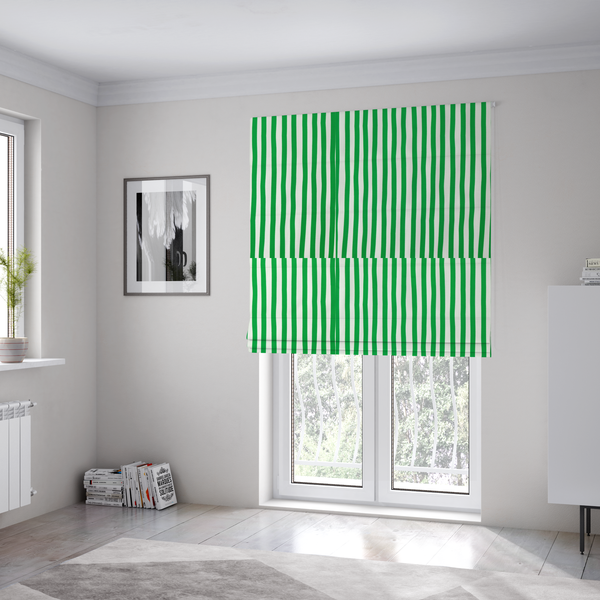 The fabric used to create these Roman blinds is a white fabric patterned with vertical, hand-drawn green stripes that feature a slight, organic waviness.