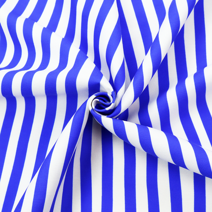 A white fabric patterned with vertical, hand-drawn blue stripes that feature a slight, organic waviness.   