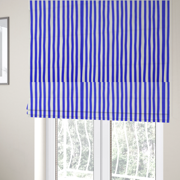 The fabric used to create these Roman blinds is a white fabric patterned with vertical, hand-drawn blue stripes that feature a slight, organic waviness.   