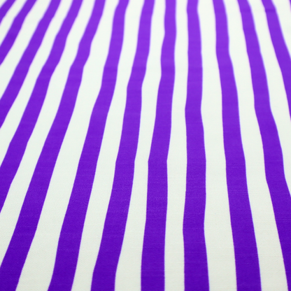 A white fabric patterned with vertical, hand-drawn purple stripes that feature a slight, organic waviness.