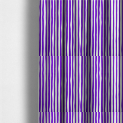The fabric used to create these made-to-measure curtains is a white fabric patterned with vertical, hand-drawn purple stripes that feature a slight, organic waviness.