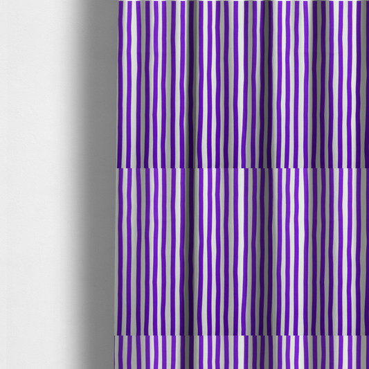 The fabric used to create these made-to-measure curtains is a white fabric patterned with vertical, hand-drawn purple stripes that feature a slight, organic waviness.