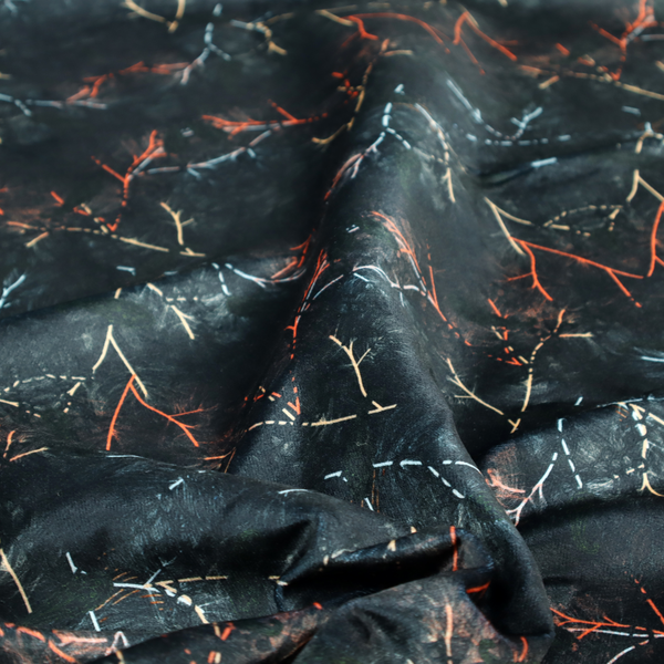 This fabric features an abstract, wolf-like motif, made up of orange and white lines on a dark, forest inspired fabric.