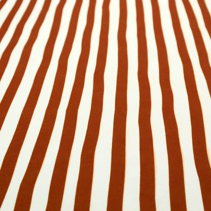 A white fabric patterned with vertical, hand-drawn brown stripes that feature a slight, organic waviness.
